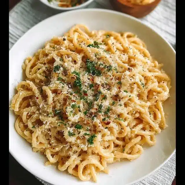 Delicious one-pan butter parmesan pasta served with fresh herbs.