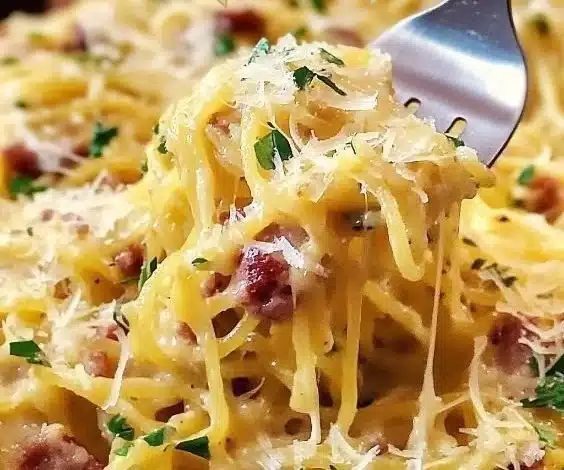 A bowl of spaghetti squash carbonara topped with parsley and parmesan cheese.