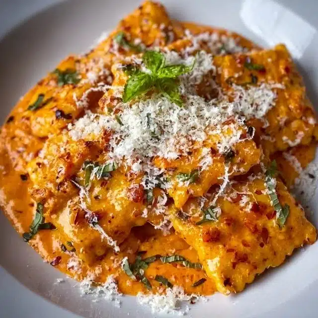 The Best Creamy Garlic Tomato Pasta plated with basil
