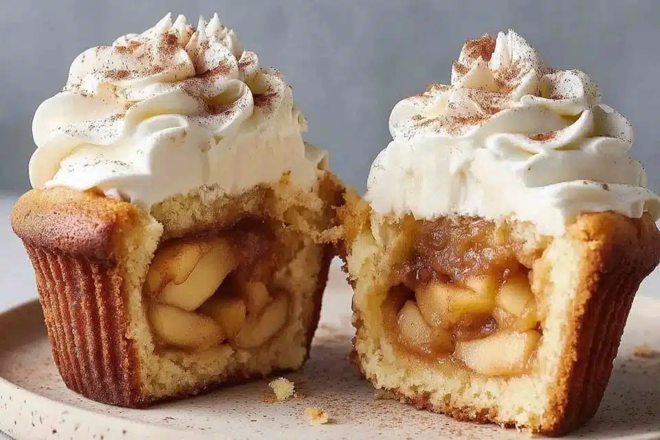 Apple pie stuffed cupcakes with cinnamon buttercream frosting on a plate