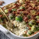 Creamy Brussels sprouts gratin with mushrooms and pancetta in a baking dish