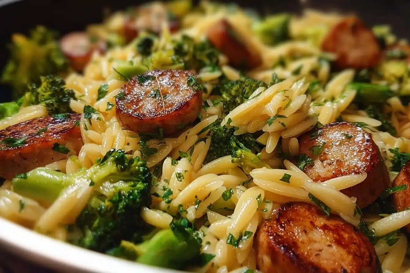 Plate of Chicken Sausage and Broccoli Orzo with fresh ingredients