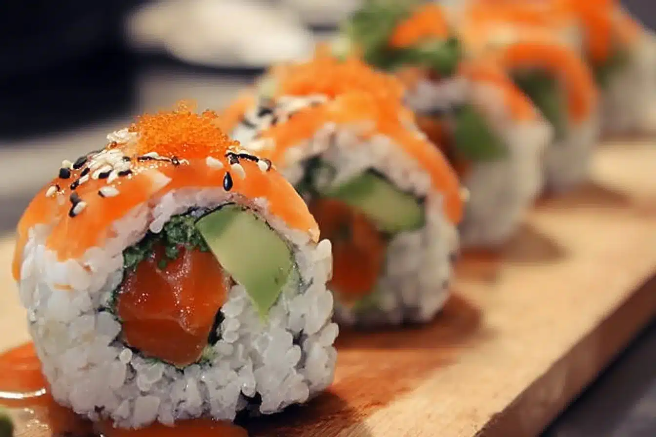 Delicious Dragon Rolls sushi with avocado and eel on a wooden plate