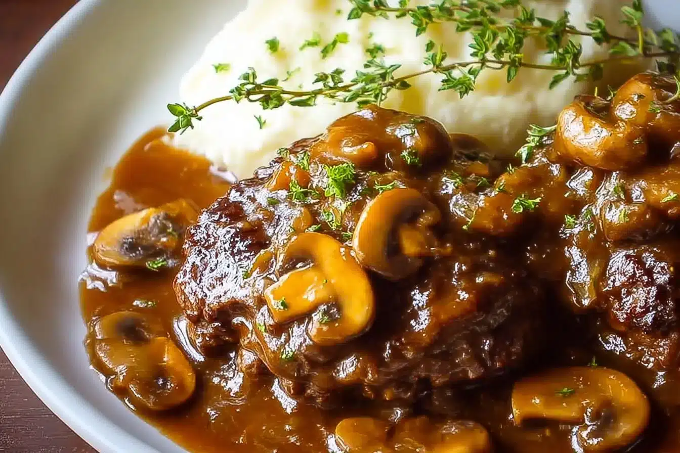 Delicious homemade Salisbury steak served with rich brown gravy and mashed potatoes