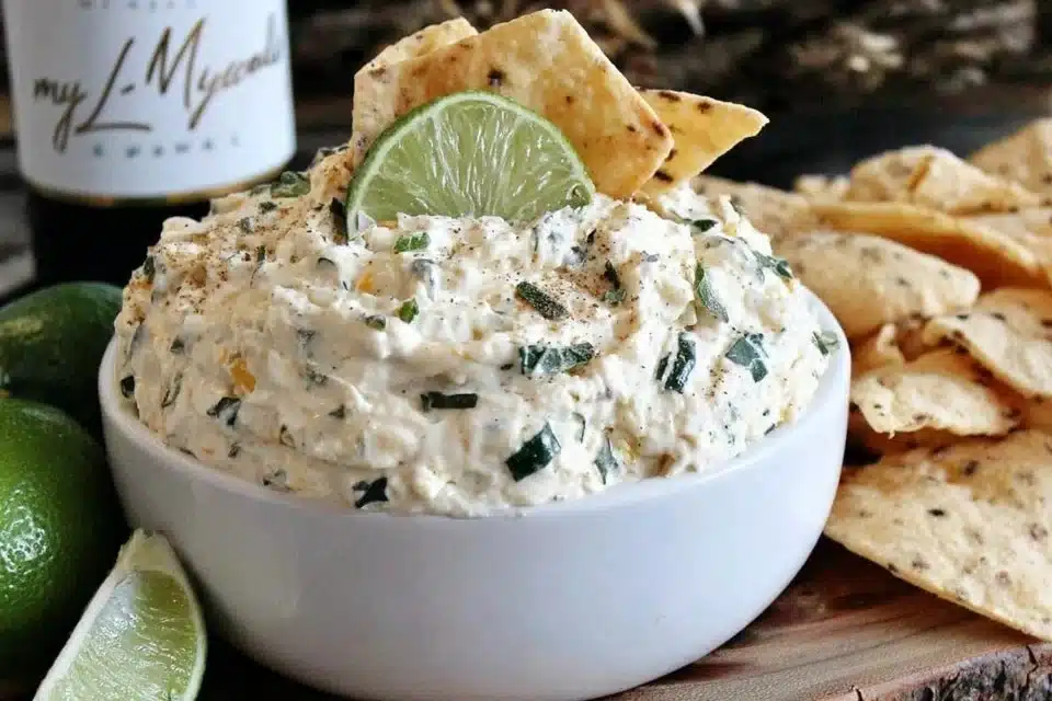 Irresistible jalapeno cream cheese dip served in a bowl with tortilla chips.