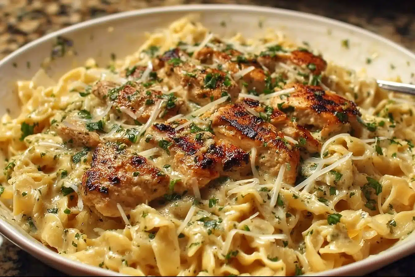 Plate of Chicken Garlic Parmesan Pasta garnished with parsley and cheese