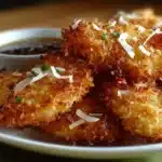 Deliciously fried Crispy Coconut Chicken served with dipping sauce
