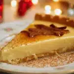 Delicious Eggnog Crème Tart topped with festive decorations and whipped cream